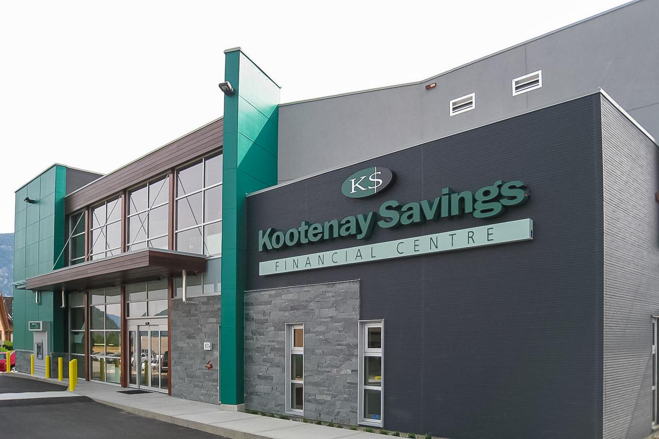 Kootenay Fresh professional using a high-tech sprayer on office furniture